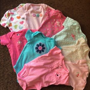 Nine onesies. Some never worn. FREE with purchase.